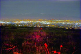 A wide-angle time-exposure view showing the valley and the distant LED